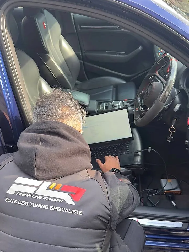 Finish Line Remaps technician flashing an Audi S3 ECU via OBD during a Stage 1+ calibration